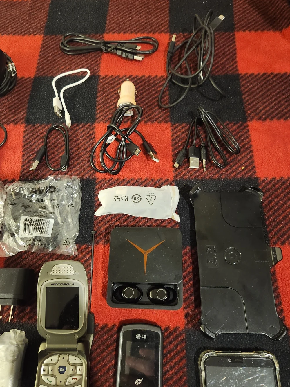 Elctronics Lot, Cellphones, Charging Cords, Remotes, And More